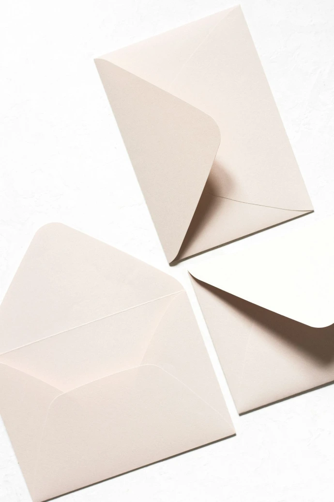 three white mail envelops